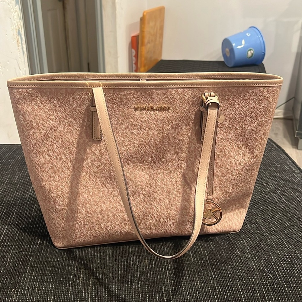 A Michael Kors bag that is in really good condition.